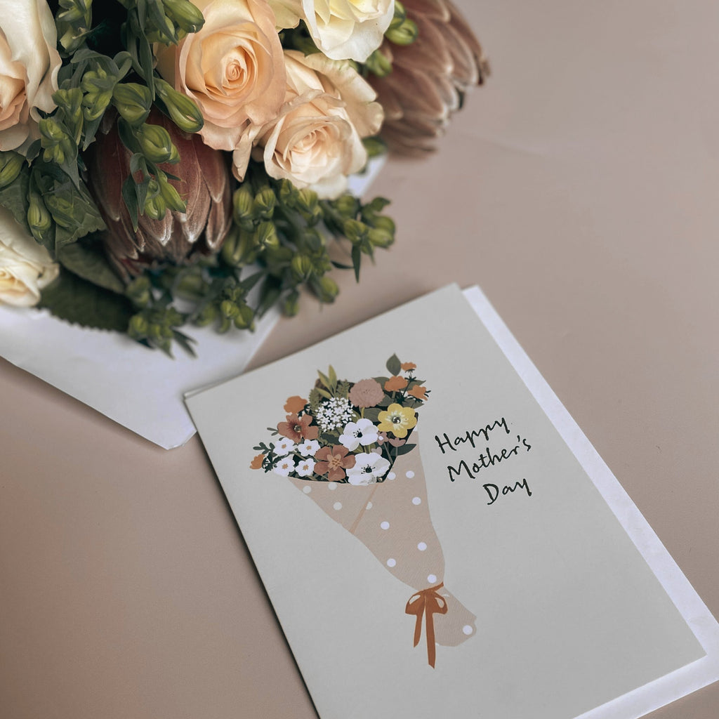 Mothers Day floral bouquet with happy mothers day card 