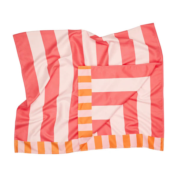 Striped blanket with pink, orange, and white pattern on a white background