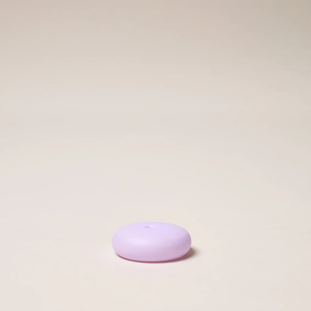 Purple object on a beige background