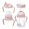 Set of baby feeding and drinking products including a bottle, sippy cup, and trainer cup on a white background.