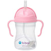 Pink sippy cup with straw and handles on a white background, featuring the b.box logo.