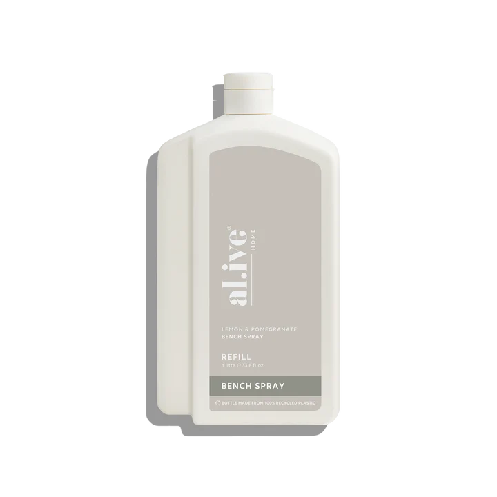 White bottle of 'alive' bench spray refill on a white background