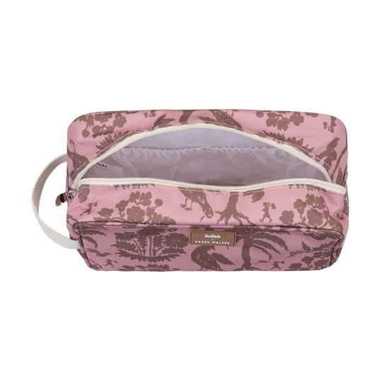 Pink floral toiletry bag with a visible brand label on a white background