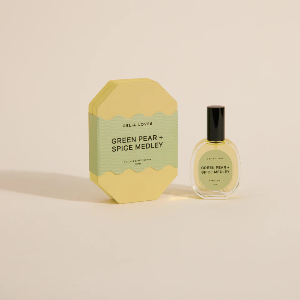 Room Spray bottle and packaging of 'Green Pear + Spice Medley' by Celia Loves on a beige background