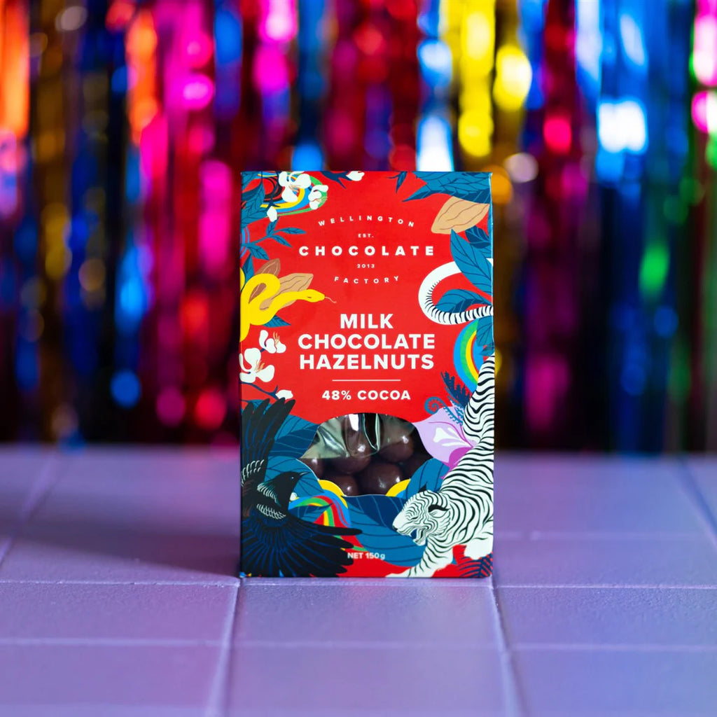 Chocolate bar packaging with colorful design on a tiled surface and multicolored background