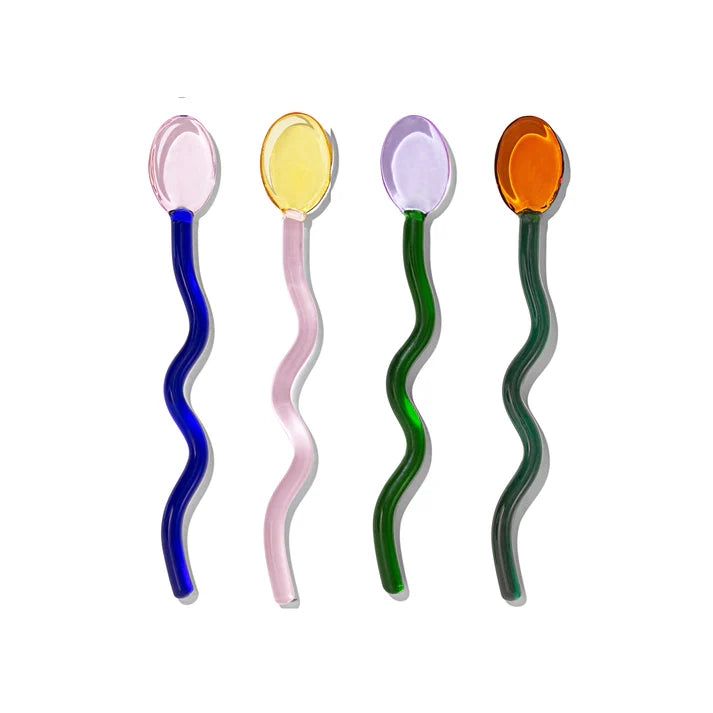 Four colorful wavy spoons on a white background