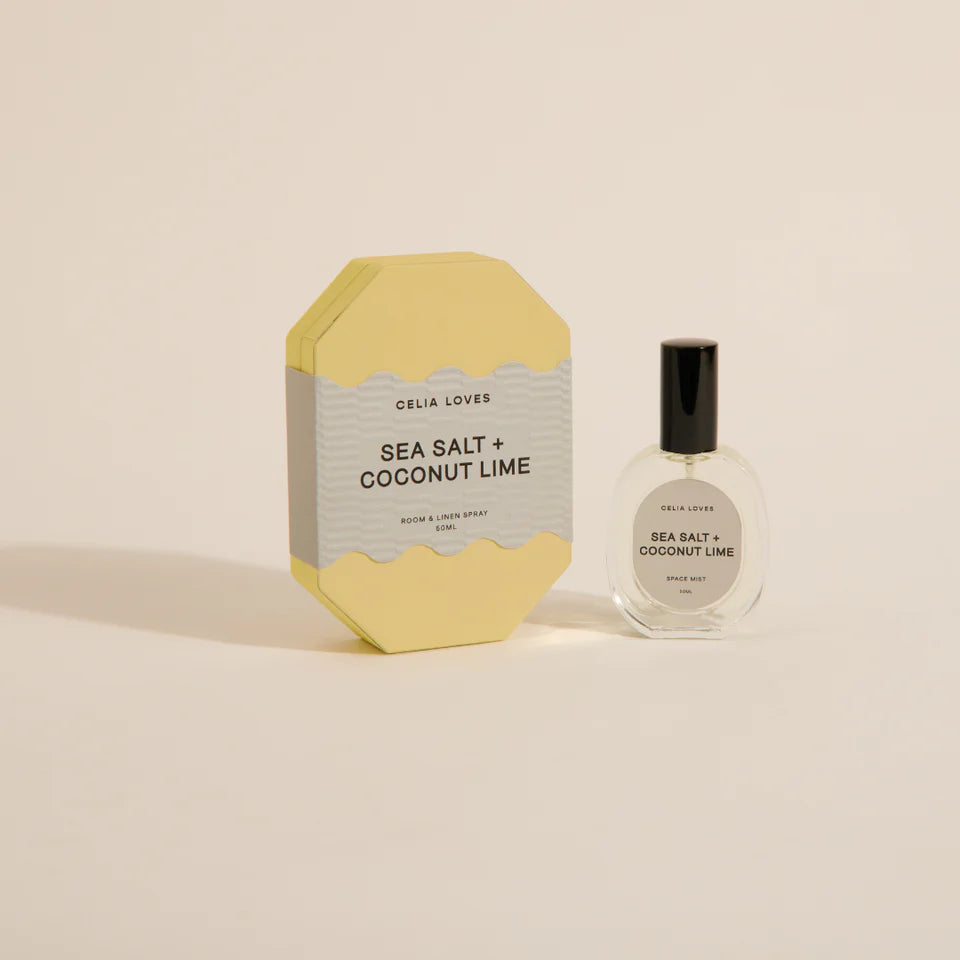 Celia Loves Sea Salt + Coconut Lime product packaging and bottle on a beige background