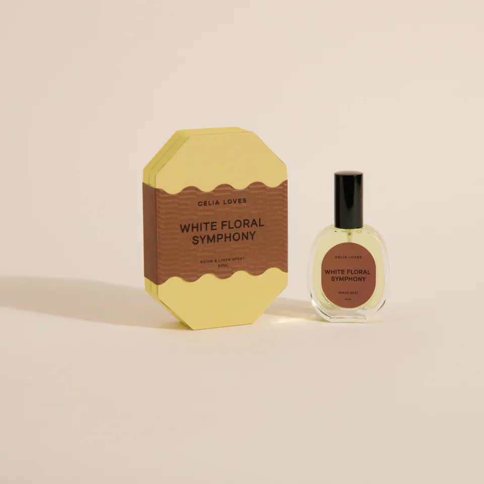 Perfume bottle and packaging of 'White Floral Symphony' by Celai Loves on a beige background