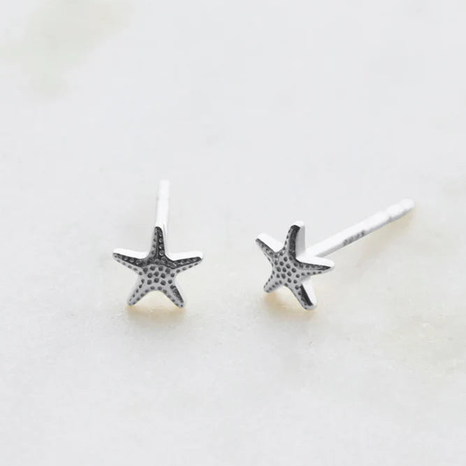 Star-shaped earrings on a white background