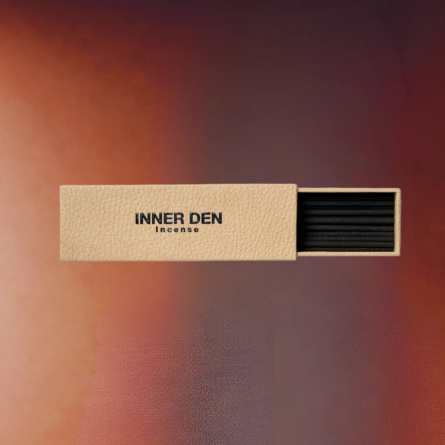 Incense box with 'INNER DEN' branding on a gradient background