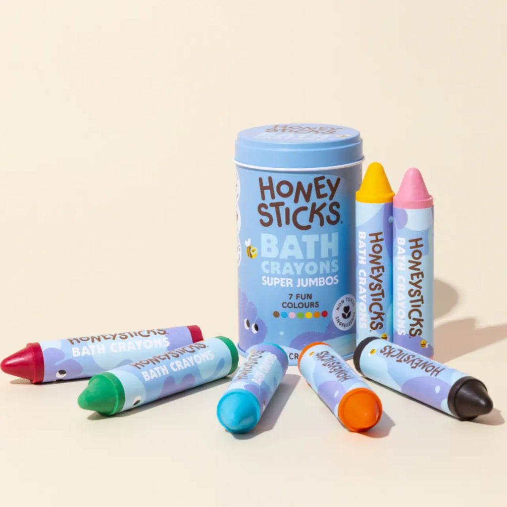 set of honey sticks bath crayons in blue packaging against a cream background