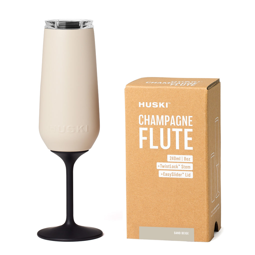 Huski champagne flute with packaging on a white background