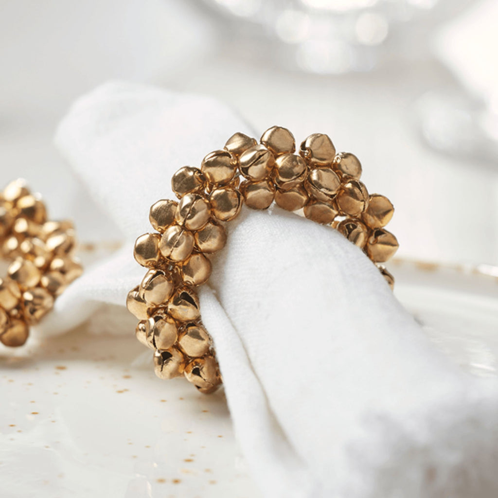 Gold bell napkin holder with napkins