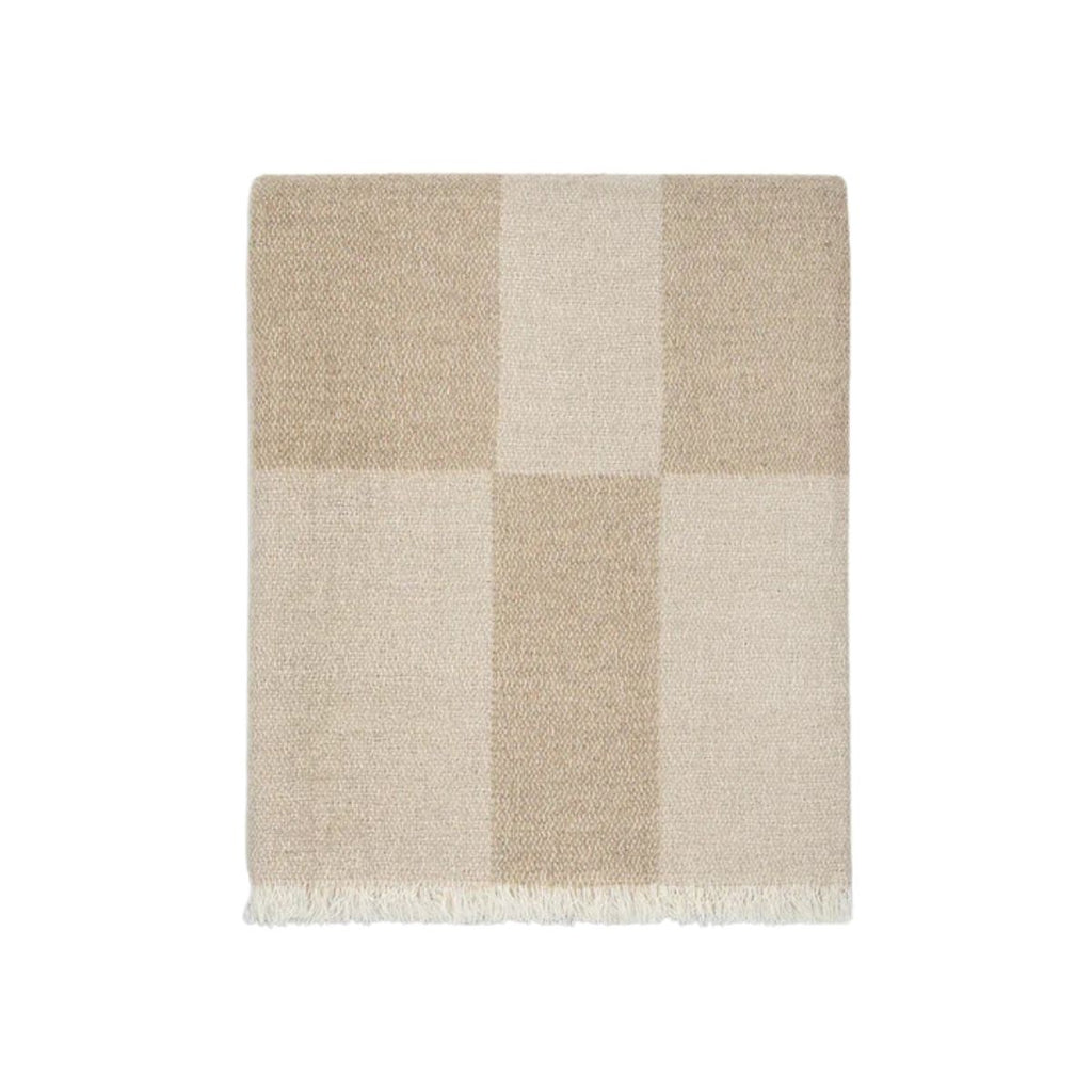 Beige and white checkered blanket on a white background