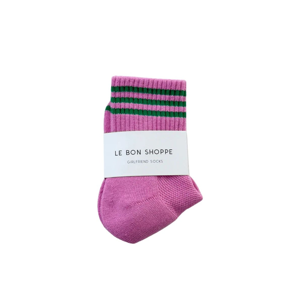Pink sock with green stripes on a white background, featuring 'Le Bon Shoppe' branding.