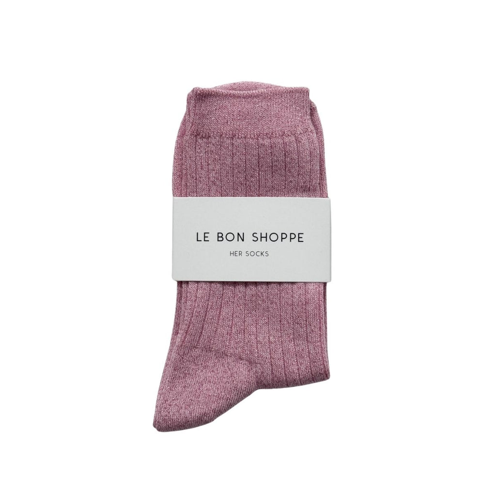 Pink socks with glitter with a white label on a white background