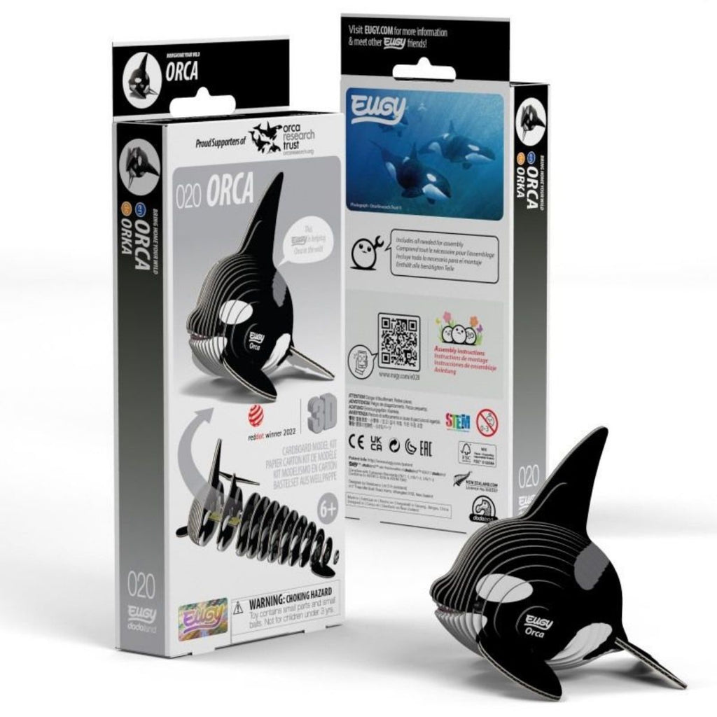 Orca toy figure with packaging on a white background