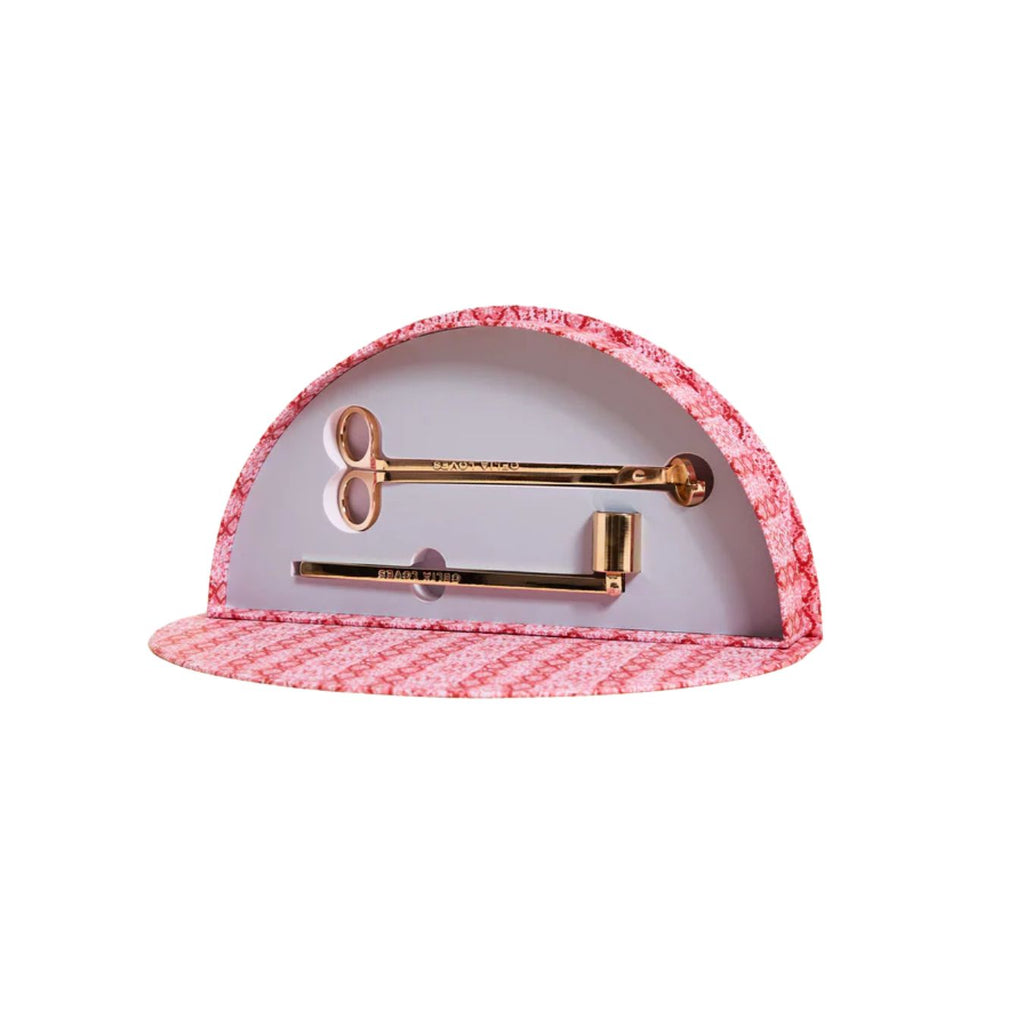 Pink and white case with gold tools on a white background