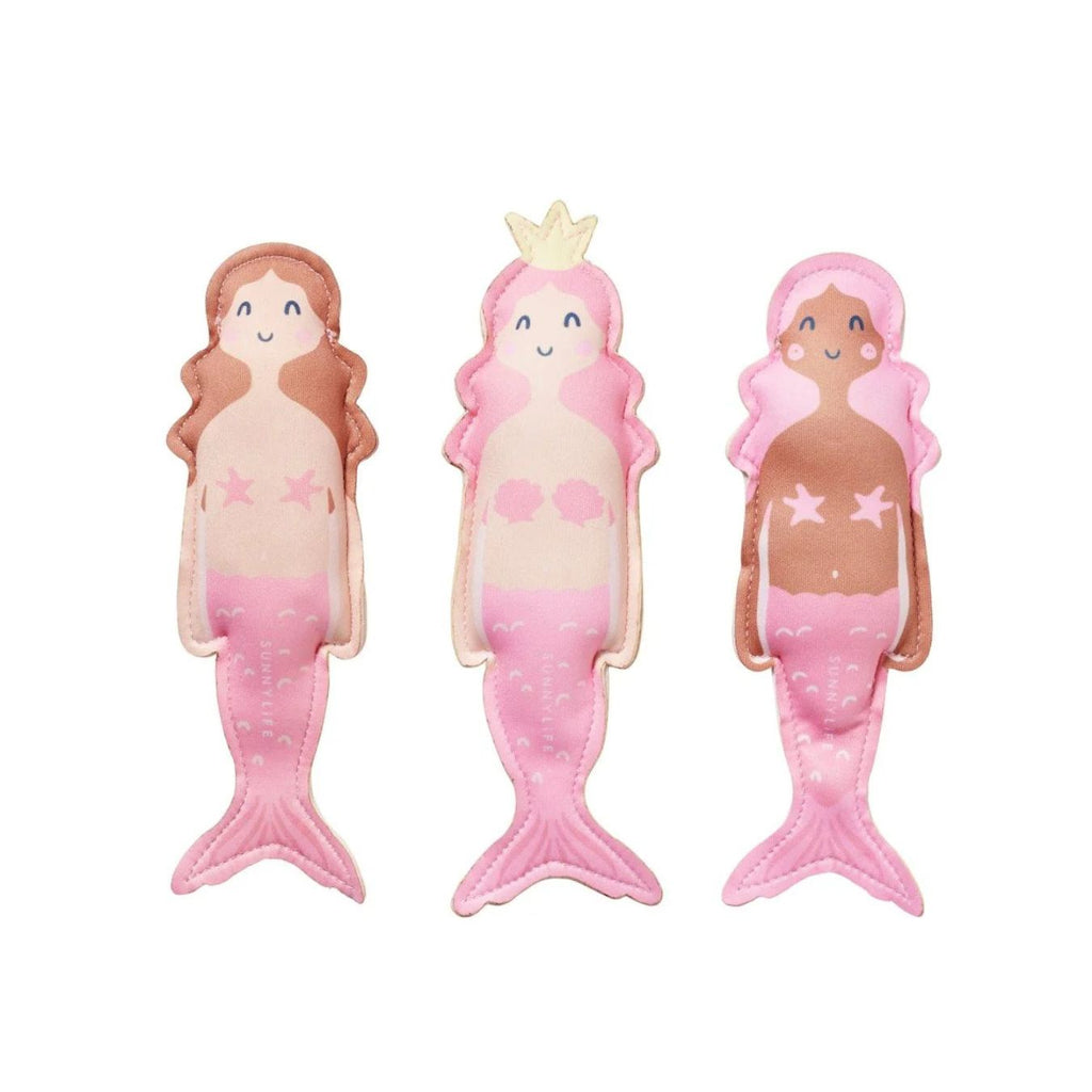 Three pink mermaid figurines with different hairstyles on a white background