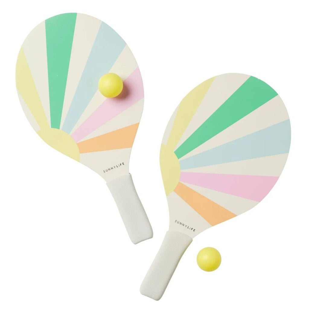 Two colorful paddle rackets with a yellow ball on a white background