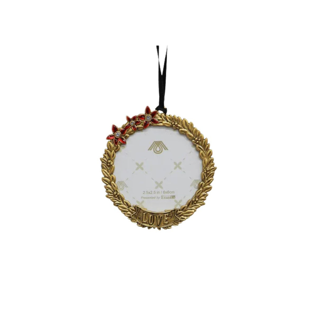Decorative ornament with gold wreath, red flowers, and 'LOVE' text on a white background