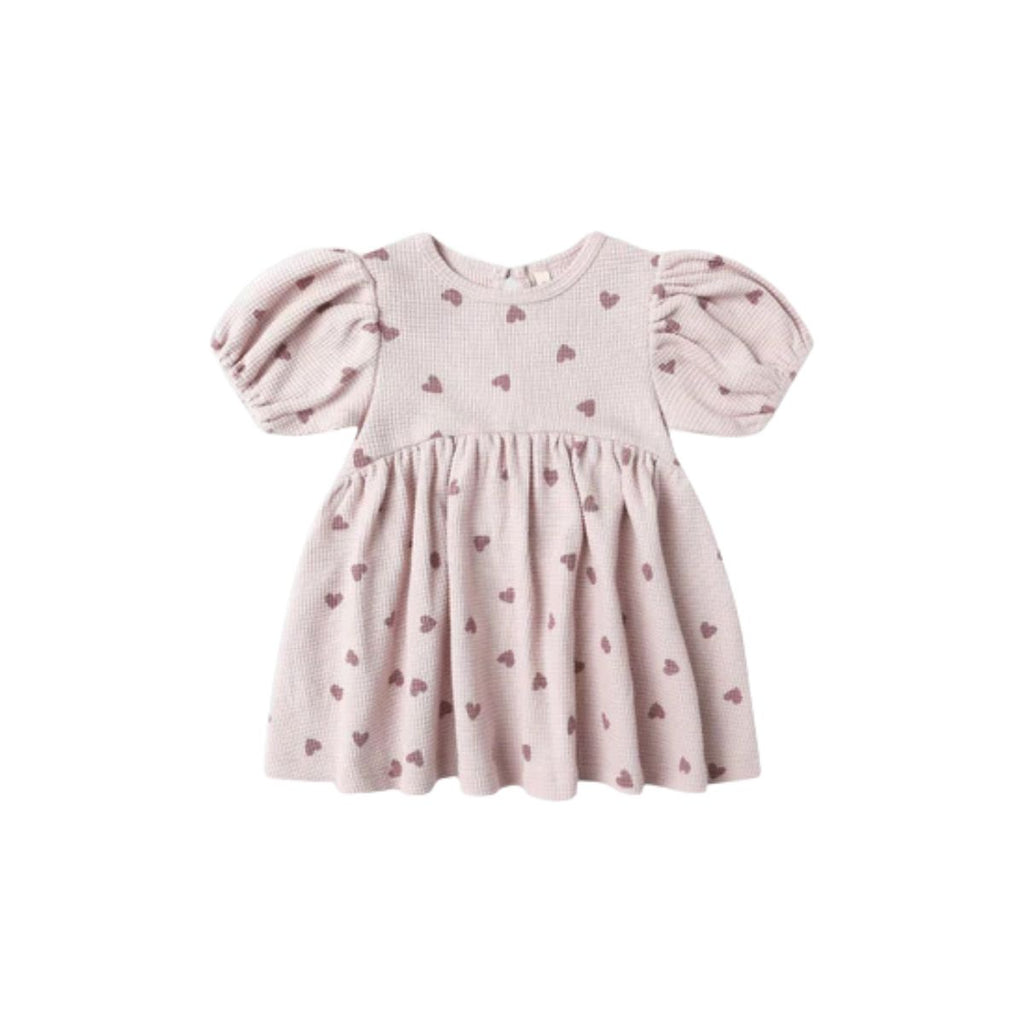 Pink dress with heart pattern on a white background