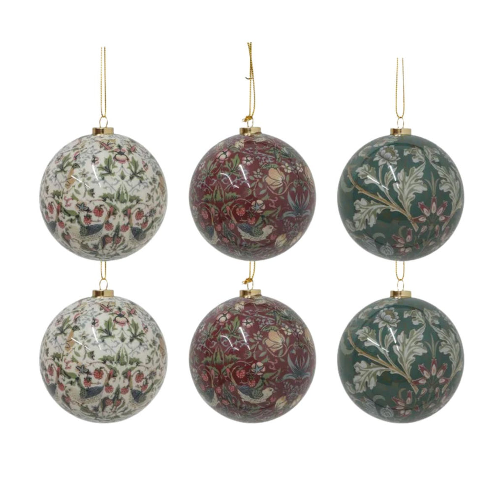 Set of six floral-patterned Christmas ball ornaments on a white background