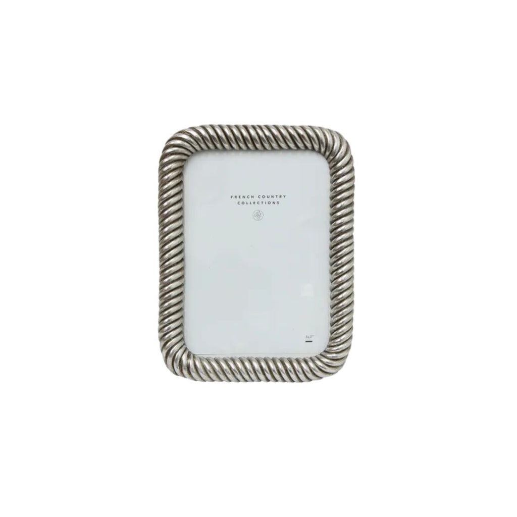 Decorative picture frame with a rope-like design on a white background