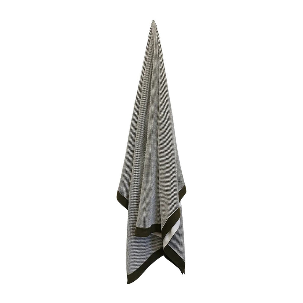 Gray towel with black border on a white background
