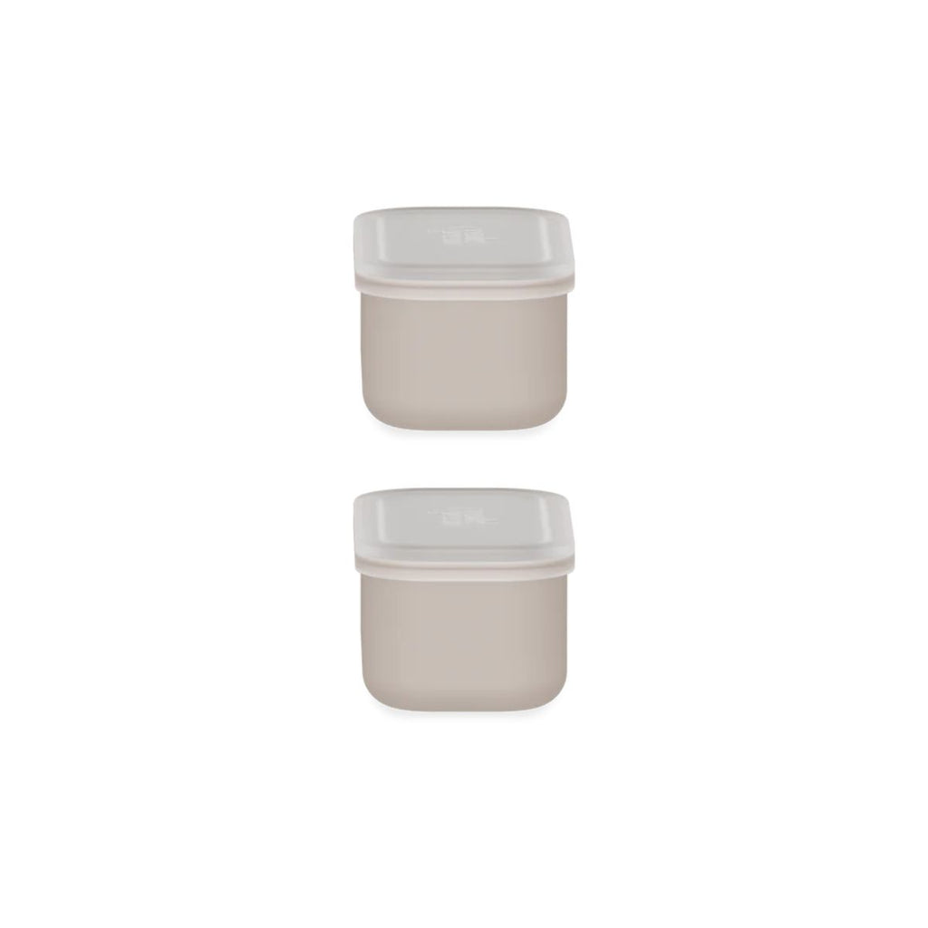 Two beige square containers with white lids on a white background