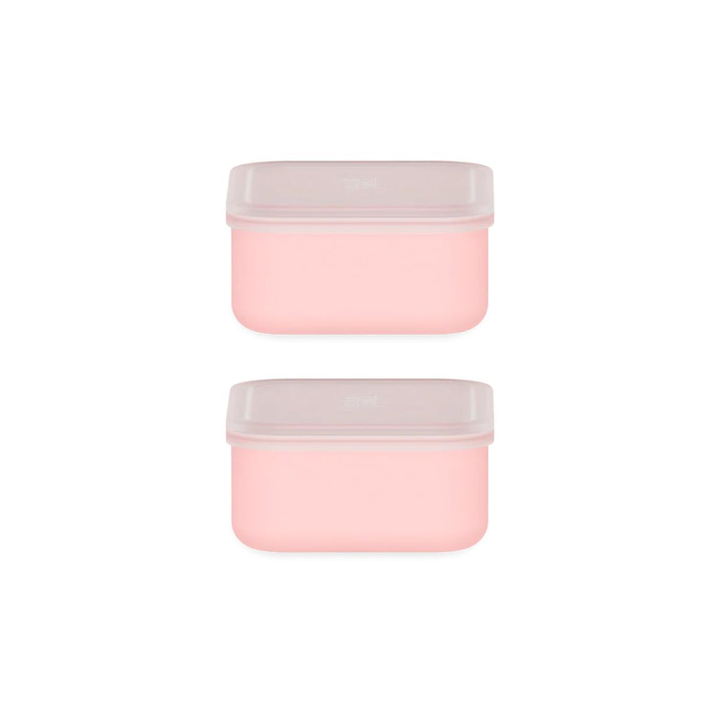 Two pink containers with white lids on a white background