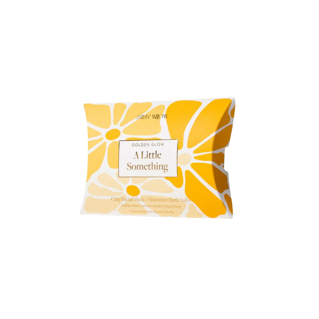 Facial mask packaging with yellow and white design on a white background