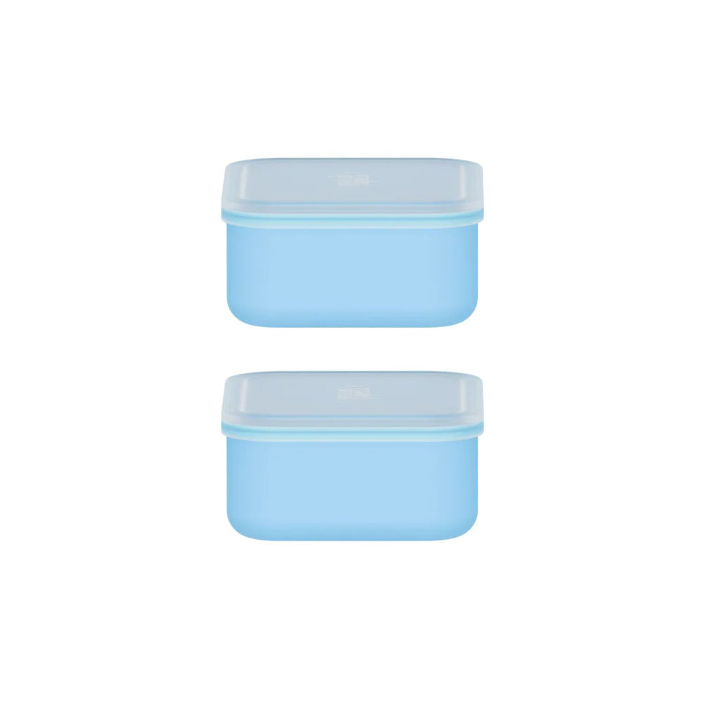 Two blue silicone containers with lids on a white background
