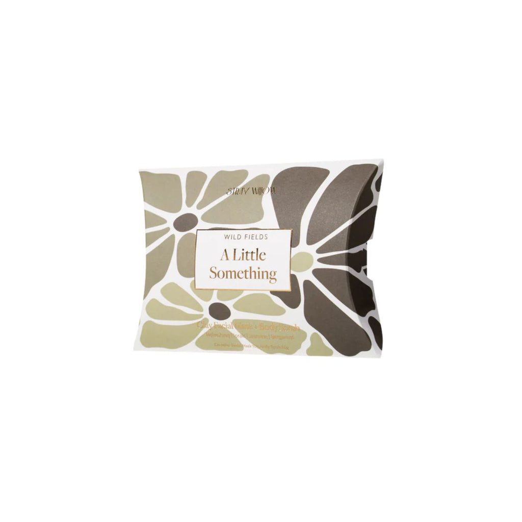 Skin care packaging with floral pattern and 'A Little Something' text on a white background