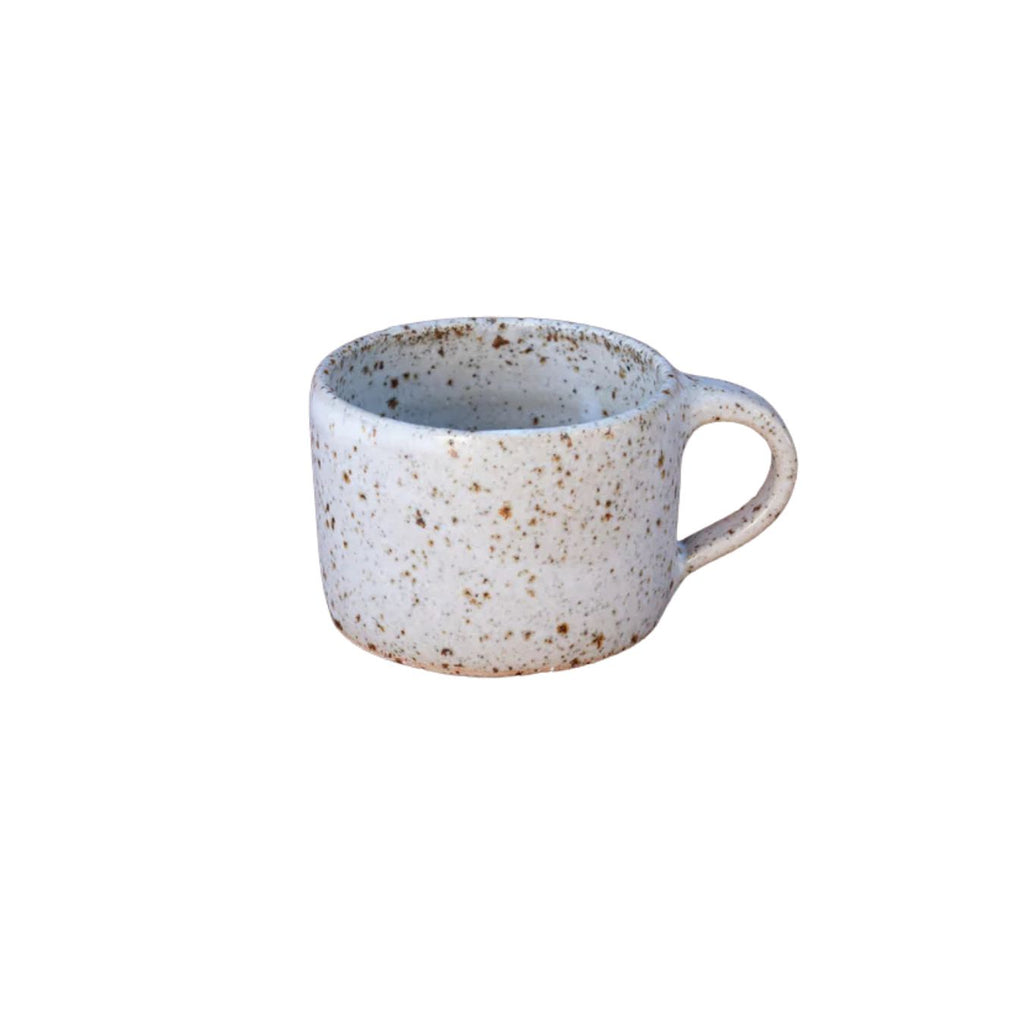 Speckled ceramic mug on a white background