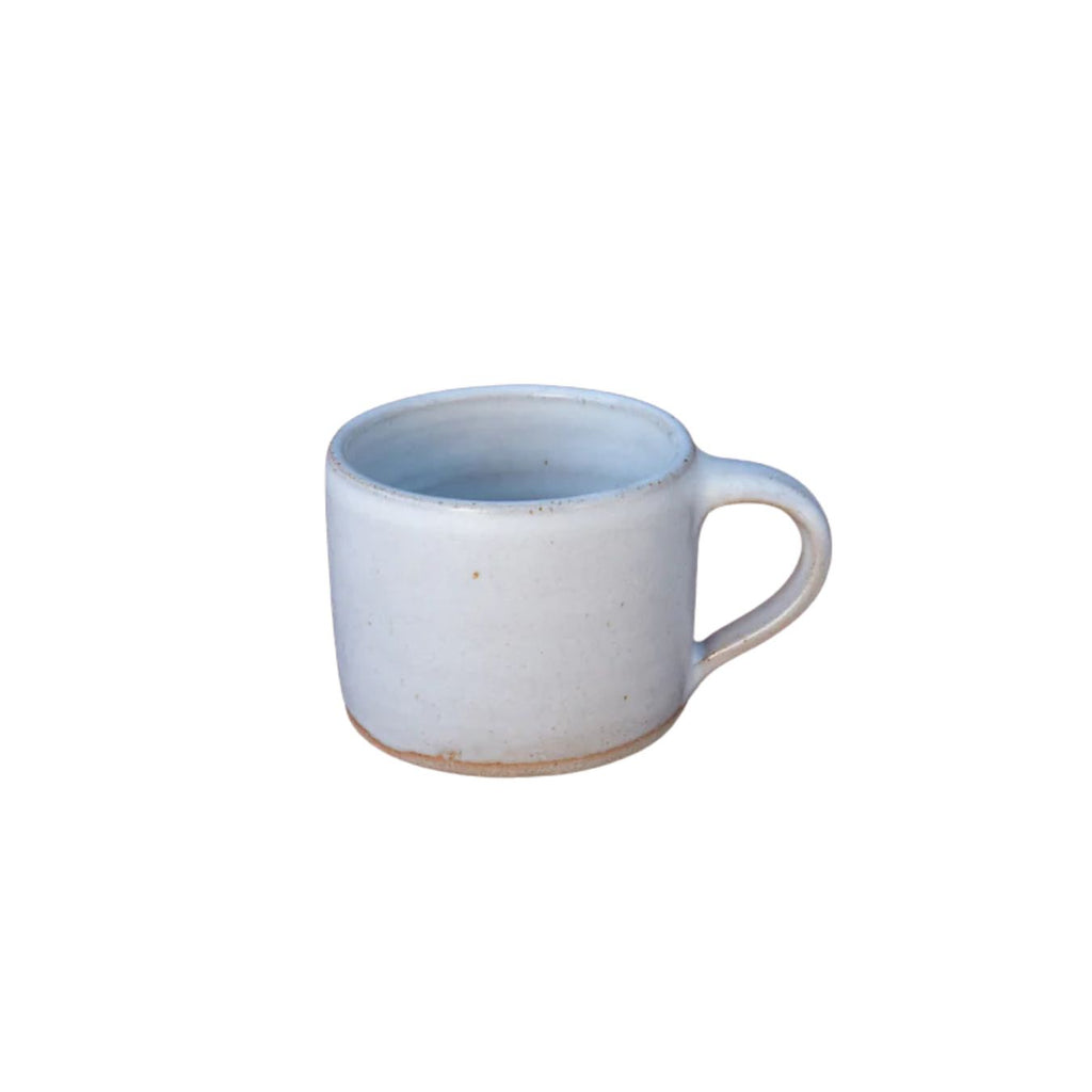 White ceramic mug with a blue interior on a white background
