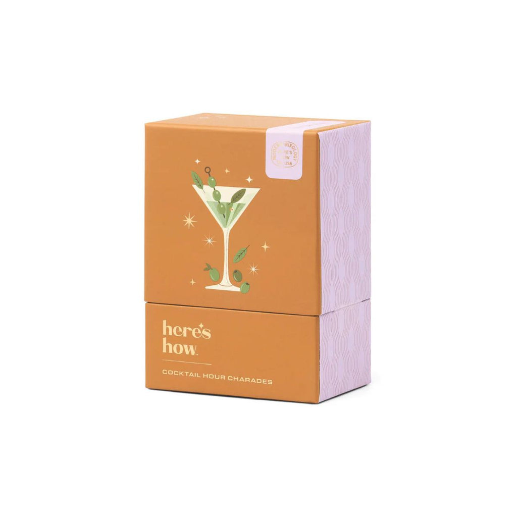 Orange packaging box with cocktail illustration and 'here's how' text on a white background