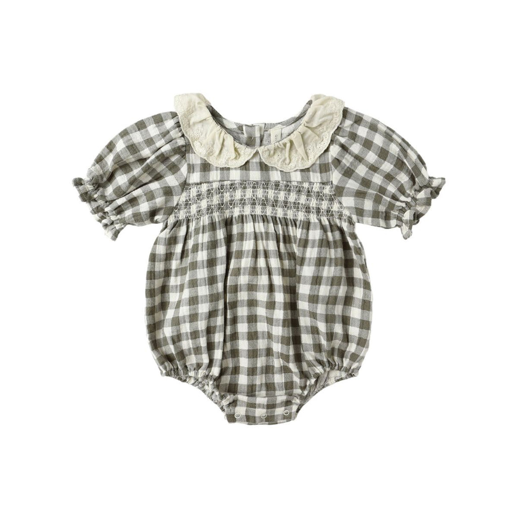 Checkered baby romper with a collar on a white background