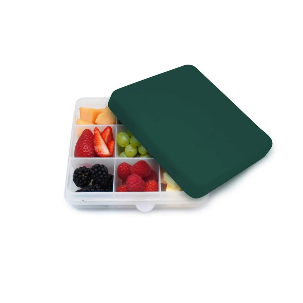 Fruit compartment with a green lid on a white background