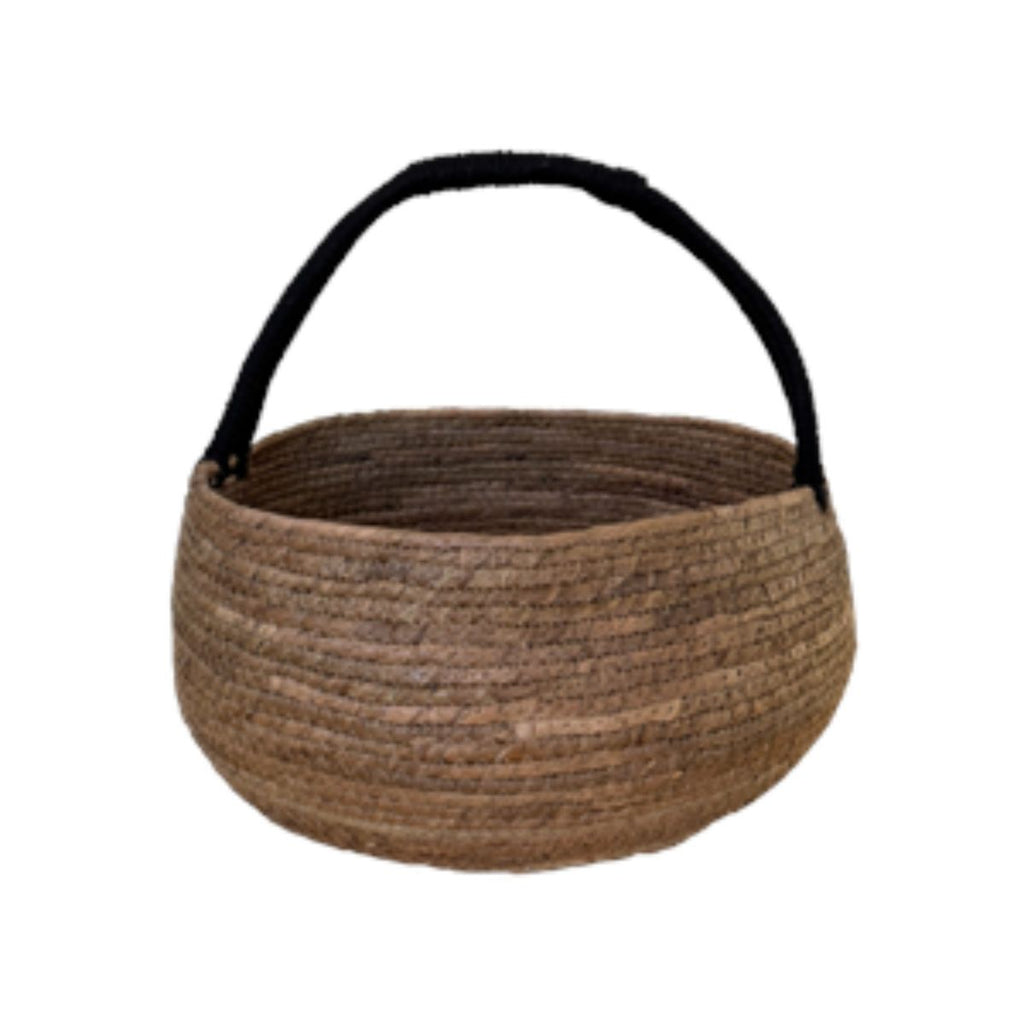 Woven basket with a black handle on a white background