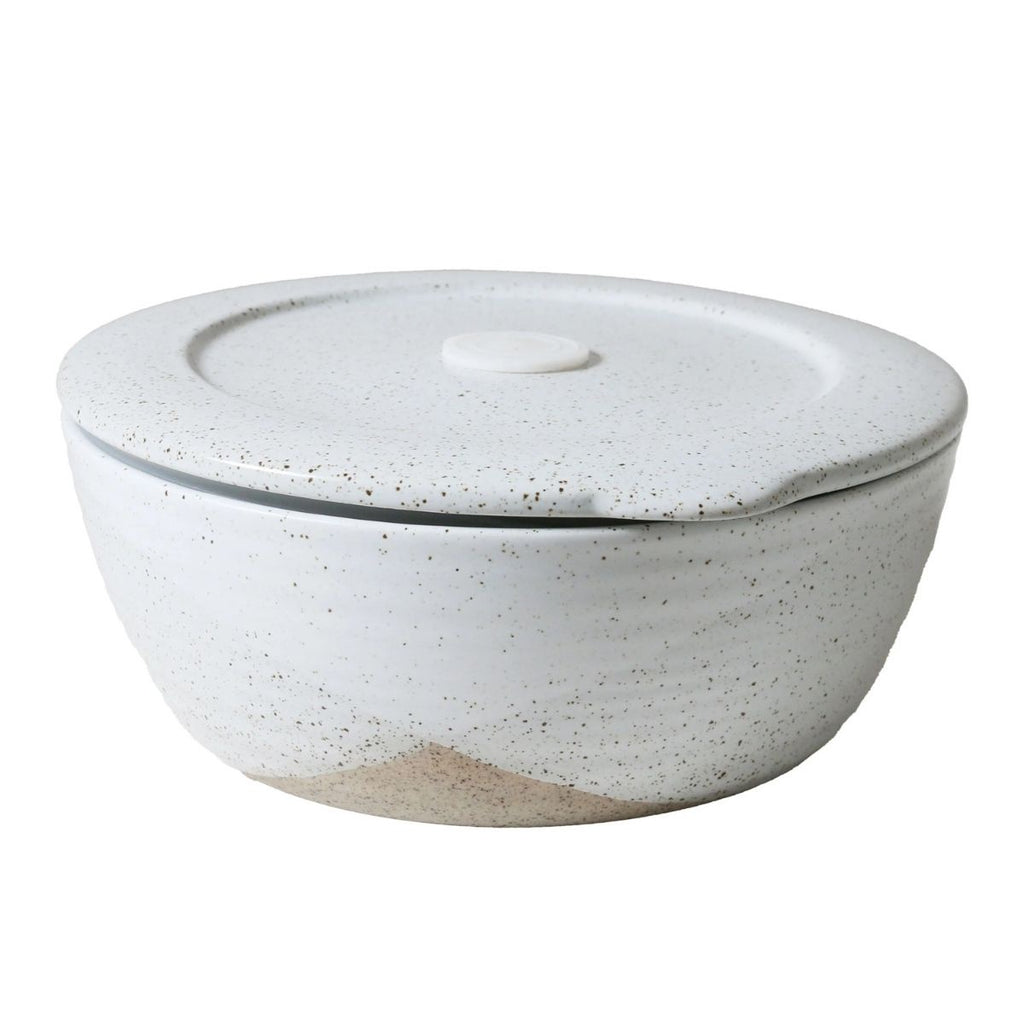 Speckled gray ceramic bowl with lid on a white background