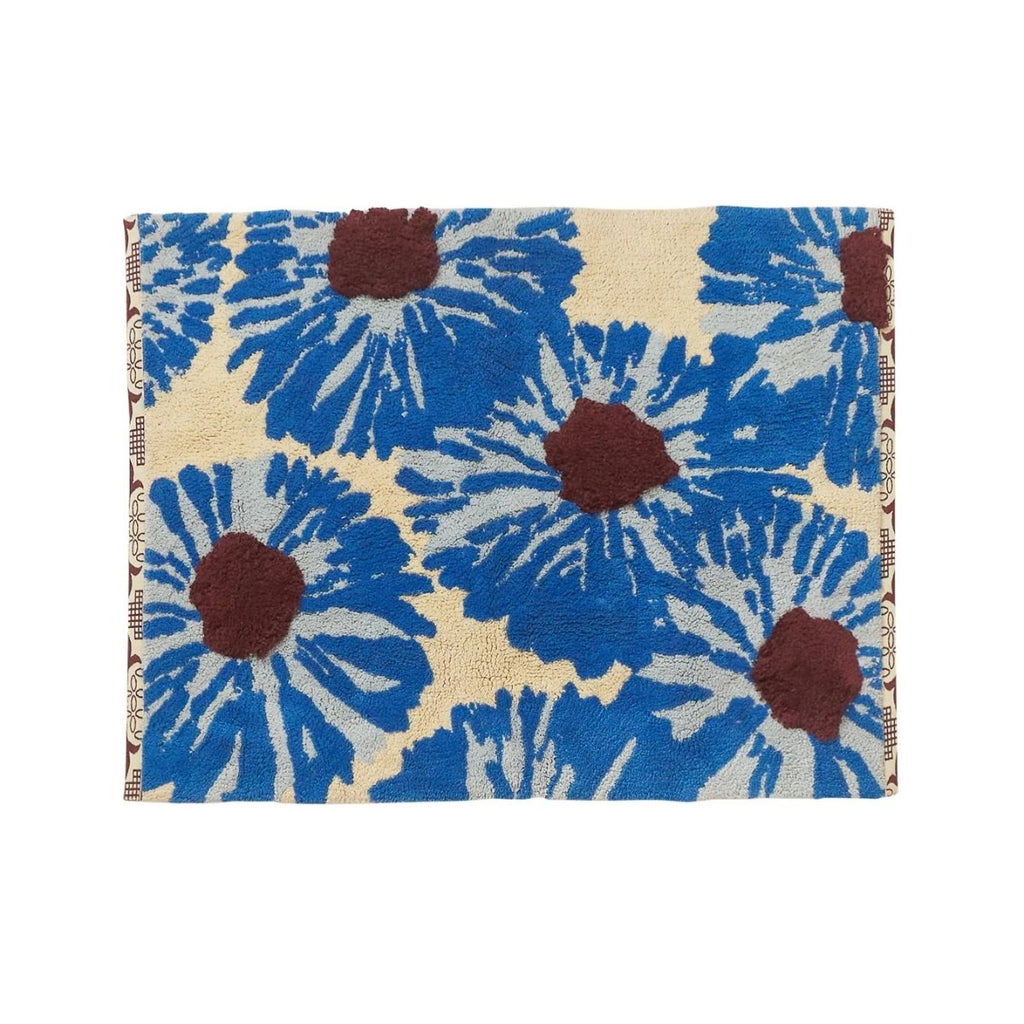 bath mat with blue floral pattern on a beige background
