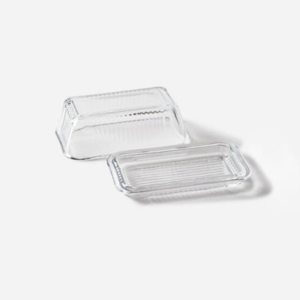 Clear plastic container with lid on a light gray background