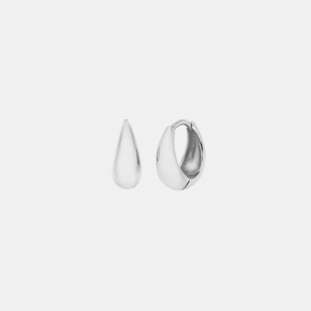 Pair of silver hoop earrings on a light gray background