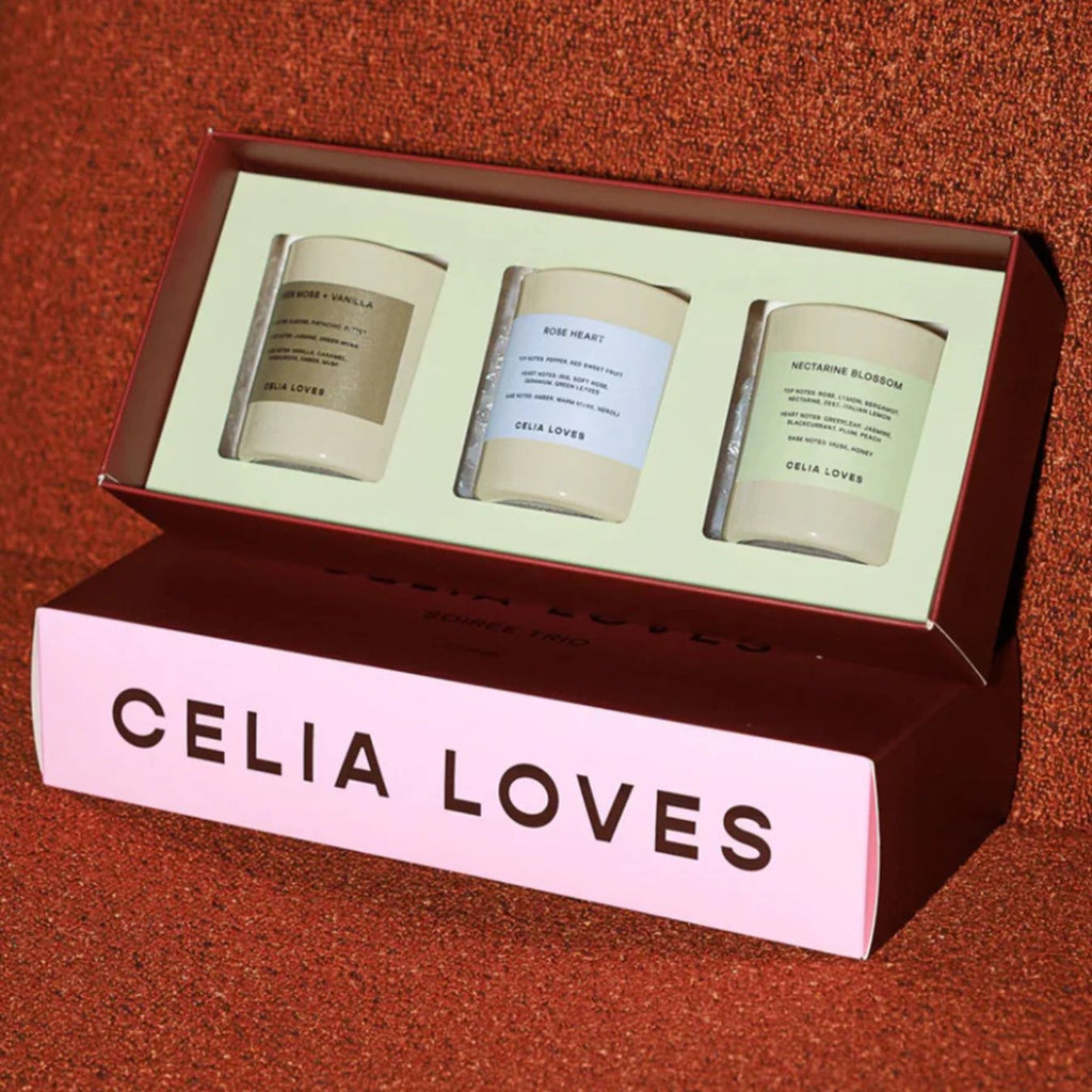 Three candles in a box with 'Celia Loves' branding on a red background