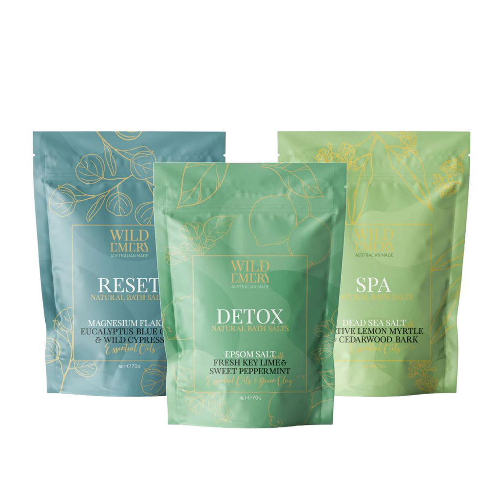 Three Wild Emory bath salt packages on a white background
