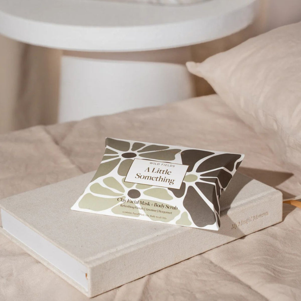 Product packaging with floral design on a beige surface