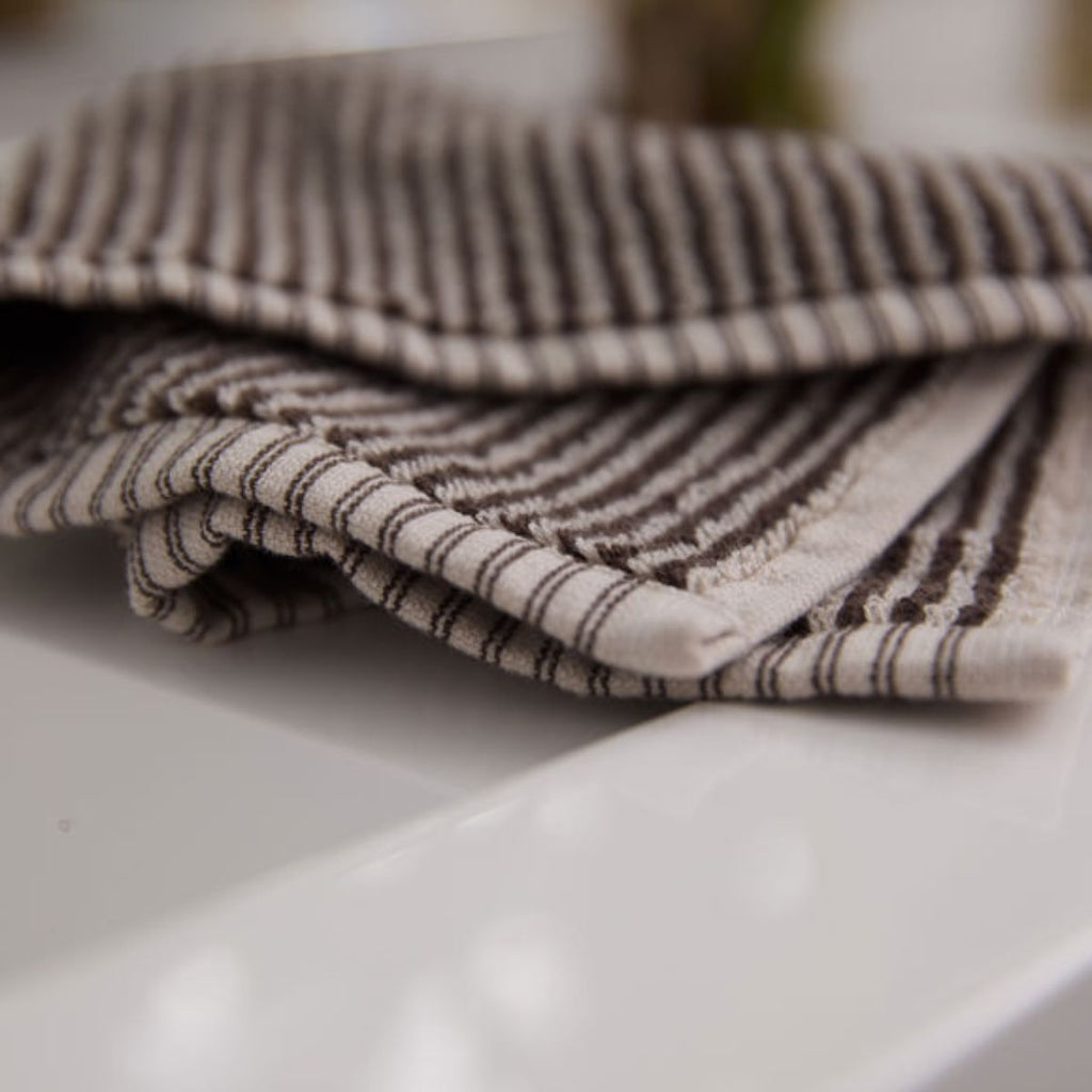 close up  of towel fabric featuring a brown and cream stripe