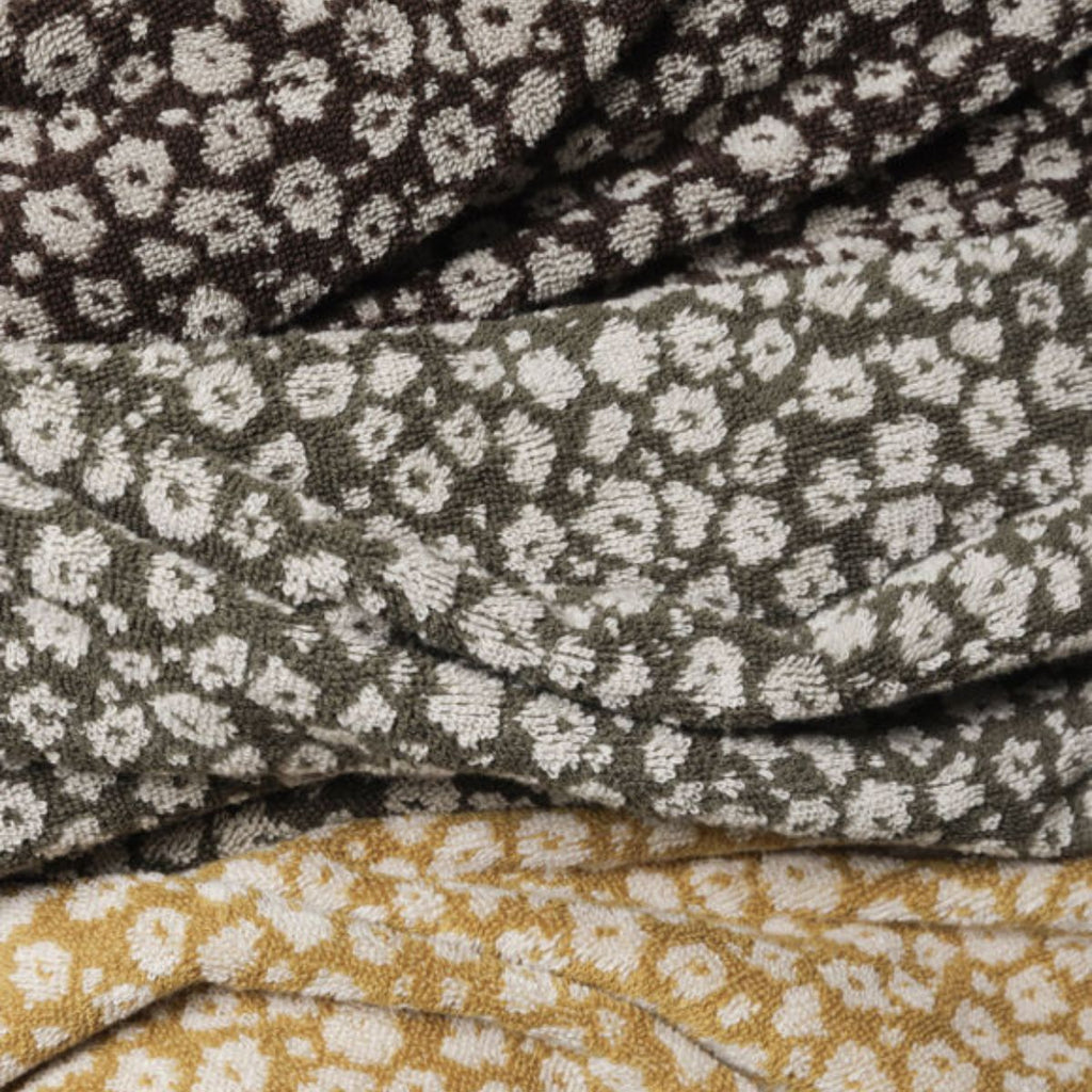 close up of three floral towel fabrics