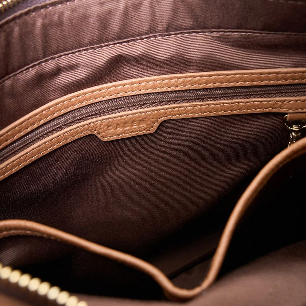 Close-up of a brown fabric surface with a zipper